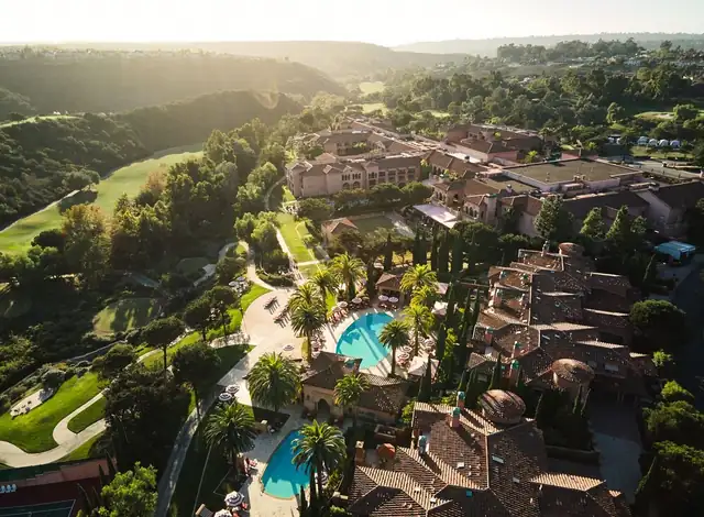 Fairmont Grand Del Mar in San Diego, large pool and buildings among greenery