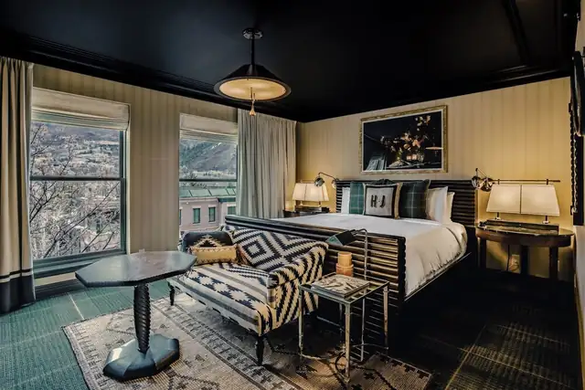 Hotel Jerome in Aspen, guest room with a large bed and nightstands
