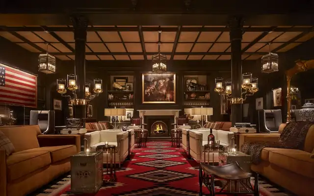 Hotel Jerome in Aspen, lobby with a large fireplace