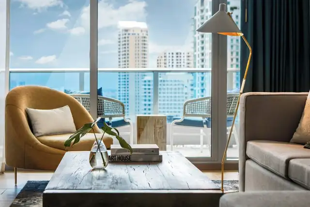 The Kimpton EPIC in Miami, modern lounge with a view of the city skyline