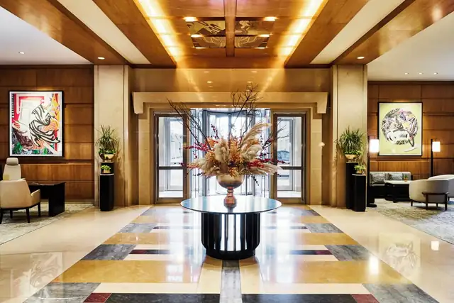 Mandarin Oriental in Boston, lobby with a central table, plants and artwork