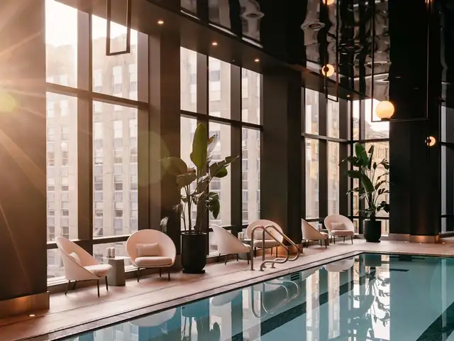 Raffles Boston in Back Bay, hotel pool with lounge chairs