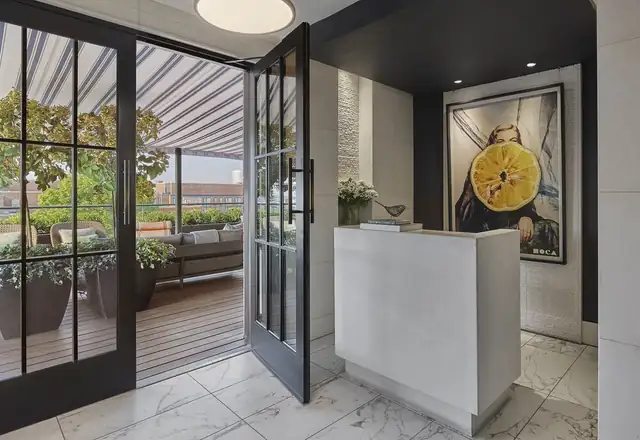 Rosewood Washington in Georgetown, reception area with a glass door