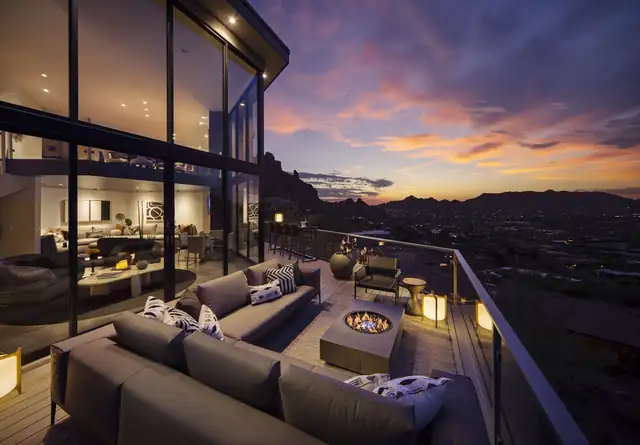 Sanctuary on Camelback Mountain in Paradise Valley, terrace with fire pit at dusk