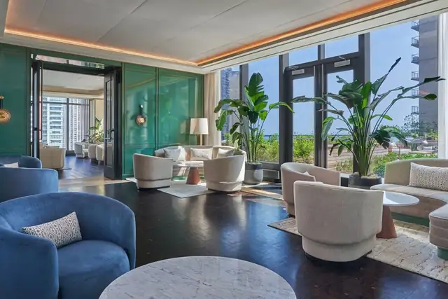 St. Regis Chicago in Chicago, modern lobby with a seating area and green wall