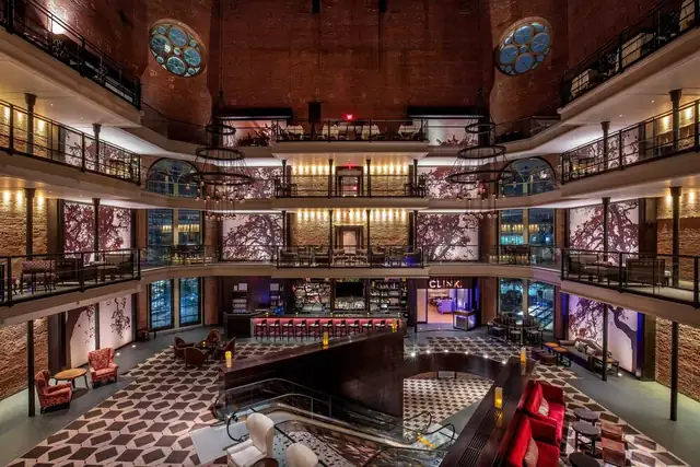 The Liberty in Boston, multi-level atrium with a central bar, seating and staircase