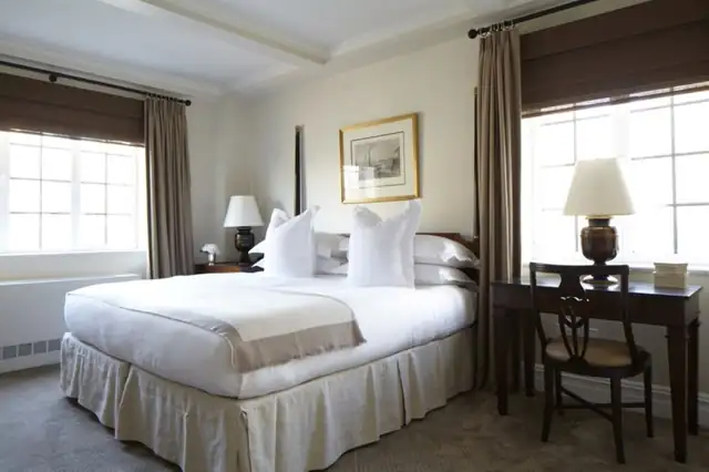 The Lowell in New York, living room with a fireplace, sofa and coffee table