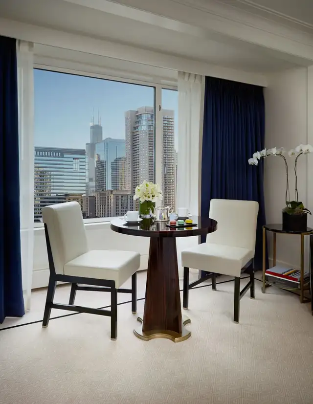 The Peninsula Chicago in Chicago, room with a round table and two white chairs