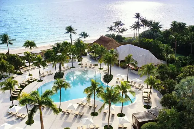 The Ritz-Carlton Key Biscayne in Miami, resort with central pool surrounded by palm trees