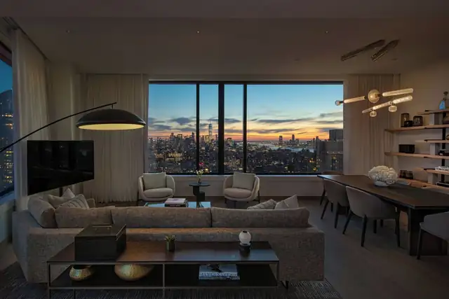 The Ritz-Carlton NoMad in New York, modern living room with large TV and seating