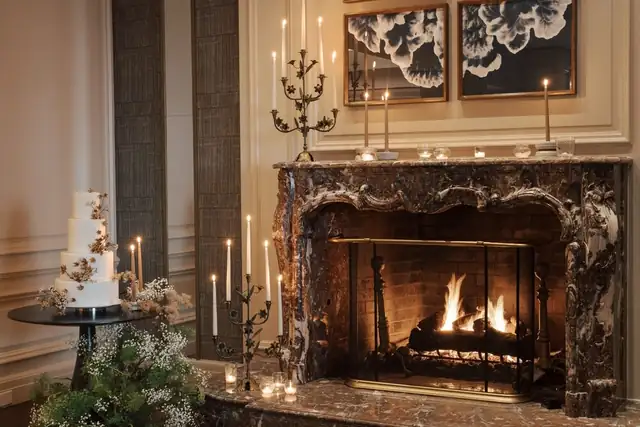 The Ritz-Carlton Tysons Corner in McLean, large lit fireplace surrounded by armchairs
