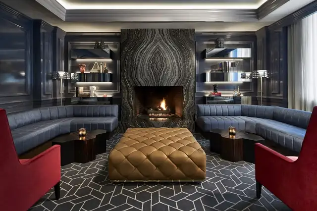 Ritz-Carlton Washington DC in Washington, modern lounge with a fireplace and dark walls